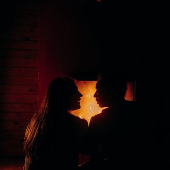silhouette of couple looking at each other